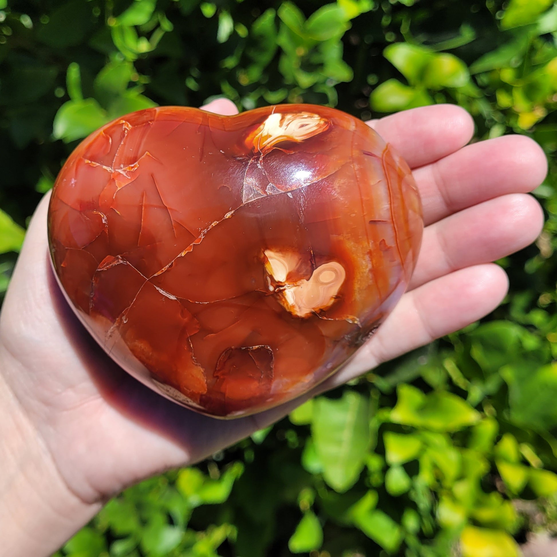 Large orange and red Carnelian heart crystal