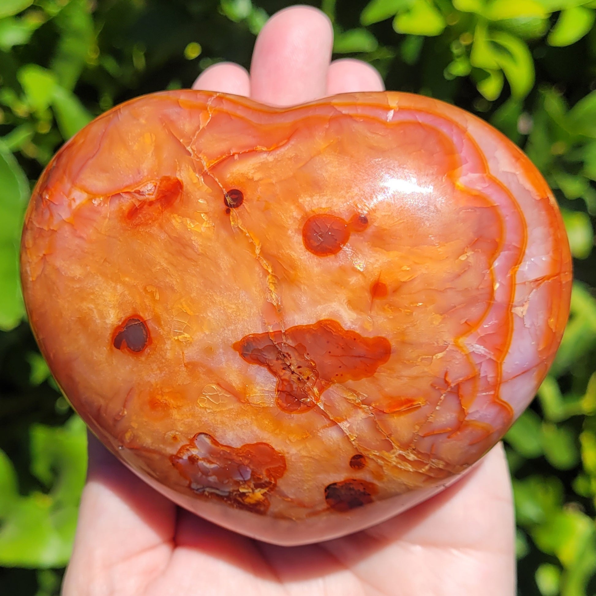 Large orange and red Carnelian heart crystal